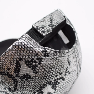 Detail of adjustable velcro strap and faux leather snakeskin texture on the baseball cap