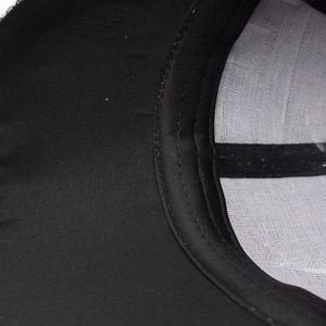 Macro view of baseball cap interior showing sweatband and white mesh support