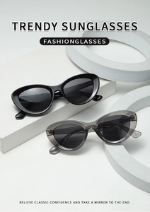 Detail of trendy small cat eye sunglasses in glossy black and transparent grey colors