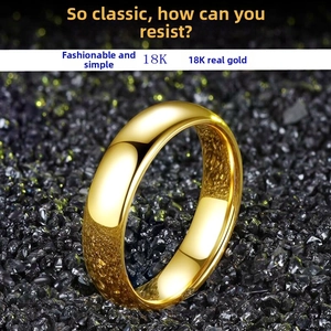 Macro shot of 4mm classic 18K gold plated stainless steel ring on dark stones