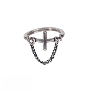 Detail view of vintage alloy ring with a 3D cross and decorative metal chain