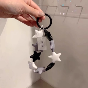 Fashionable black white and grey star-shaped silicone keychain charm for bags and phones