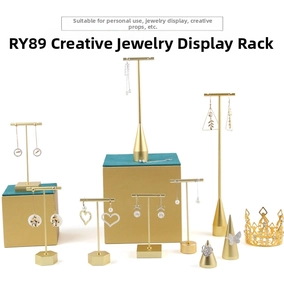 Minimalist gold metal jewelry display stand set for earrings and rings on white background