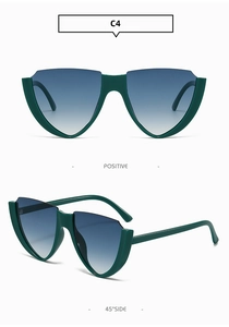 Detail view of V-shaped cat-eye sunglasses with dark green frames and gradient lenses