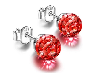Macro detail of red faceted crystal ball earrings with S925 sterling silver butterfly backs