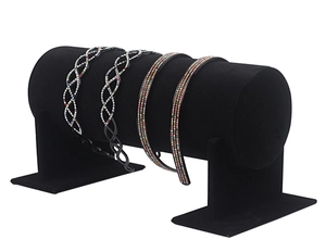 Detail view of black velvet headband display stand with sparkling rhinestone hair hoops