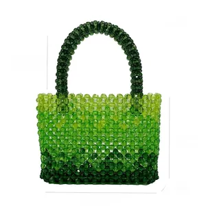 Detail showing dimensions of green gradient acrylic beaded handmade handbag on white background