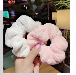 Plush faux rabbit fur hair scrunchies in white and pink for autumn winter hair styling