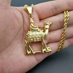 Gold plated stainless steel necklace featuring a Middle Eastern camel rider pendant and rope chain