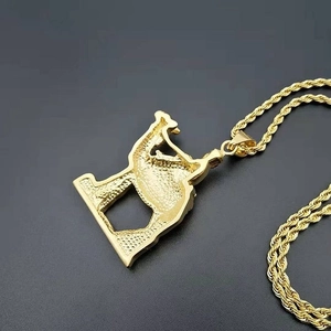 Gold-plated hip hop necklace with twist chain and Egyptian saxophone player pendant