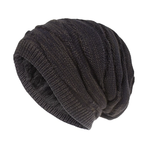 Detailed view of dark brown knitted beanie featuring thick ribbing and black fleece lining