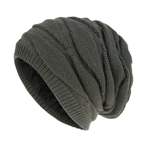 Close-up of thick diamond knit texture and warm black fleece lining on dark grey beanie