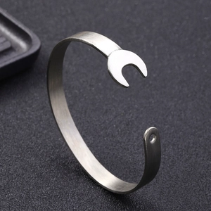 Punk style stainless steel wrench bangle with silver matte finish in a top view shot