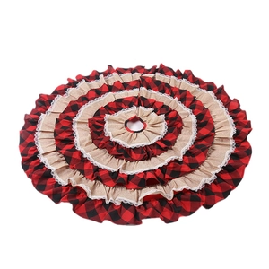 Red buffalo plaid Christmas tree skirt with ruffled burlap edges and white lace trim