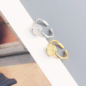 Detail view of irregular hammered texture on S925 silver round disc open rings