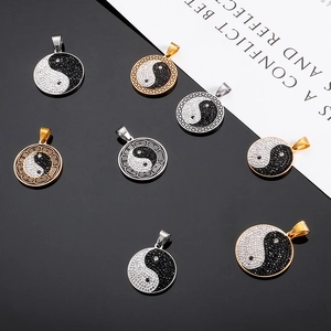 Assorted Yin Yang Bagua pendants in gold and silver steel with sparkling rhinestones
