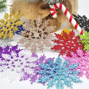 Sparkling 10cm glitter snowflake ornaments with festive holiday decor on white background