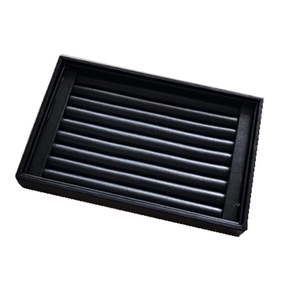 Detail view of a black velvet ring display tray with seven slots for jewelry storage