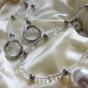 Elegant beaded bag strap with transparent beads and a large white pearl pendant