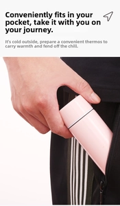 Mini pink stainless steel vacuum flask being easily placed into a small trouser pocket