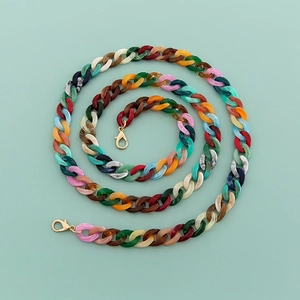 Macro shot of 120cm colorful mixed acrylic chain links with golden lobster clasps