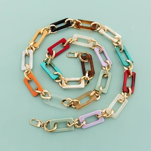 Close-up of colorful acrylic chain strap with gold clasps for bags and phone cases