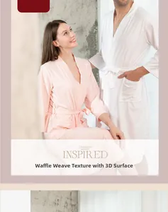 Detail of waffle weave texture on breathable cotton bathrobes for couples in pink and white