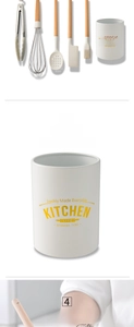 Detail of cream silicone kitchen utensils with wooden handles in a matching storage bucket