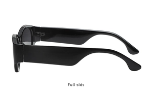 Side view of modern black oval sunglasses featuring wide temples and dark tinted lenses