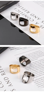 Close-up of stainless steel bottle opener rings in silver, black and gold finishes