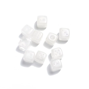 Macro shot of 15mm white natural stone dice beads for creative DIY jewelry crafts