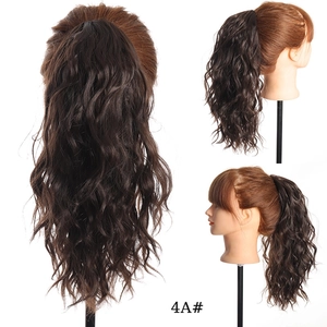 Detail view of 30cm water wave synthetic drawstring ponytail in 4A dark brown color