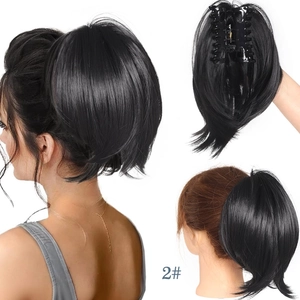 Detail view of black claw clip ponytail extension with internal clip and model styling
