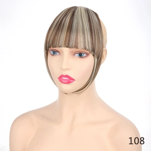 Macro view of air fringe hairpiece with sideburns in brown and gold balayage synthetic fiber