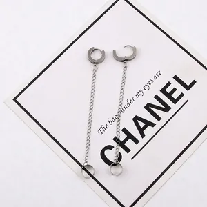 Detail view of silver stainless steel chain earrings with ear cuff and stud connector