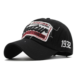 Close-up of black vintage baseball cap featuring distressed Arizona embroidery and 1932 side logo
