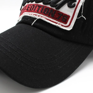 Close-up of Limited Edition 76 embroidery and reinforced stitching on black baseball cap