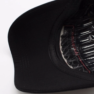 Detailed view of the black baseball cap interior featuring cotton sweatband and stitching