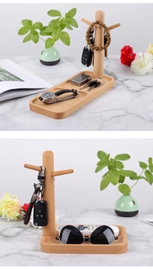 Detailed view of beech wood jewelry and key stand with dual groove base and hooks