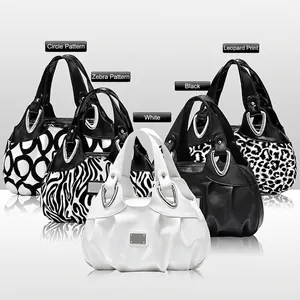 Chic printed tote bags in zebra, leopard, and solid leather patterns with metal rings