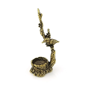 Porte-encens en bronze antique avec oiseau et détails de texture de souche d'arbre