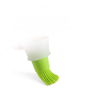 Detail of soft green silicone brush head with heat-resistant bristles for BBQ grilling