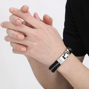 Men's black braided leather bracelet with a polished silver-tone stainless steel clasp