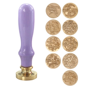Sealing wax kit with purple handle and 9 brass heads featuring assorted messages