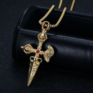 Golden titanium steel Vajra pendant necklace with red crystal on black jewelry box