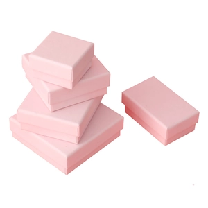 Pink jewelry gift boxes in various sizes for rings and necklaces on white background