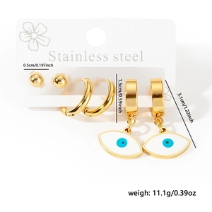Detail view of gold stainless steel earring set with evil eye charm and size specs