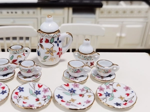 Detailed view of 15-piece miniature ceramic floral tea set for 1:12 dollhouse kitchen
