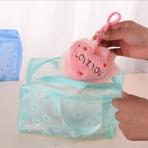 Floral PVC waterproof toiletry bag in light blue with heart-shaped sponge accessory