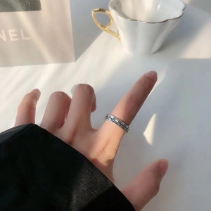 Vintage silver adjustable ring with Roman numerals and week days on a woman's finger